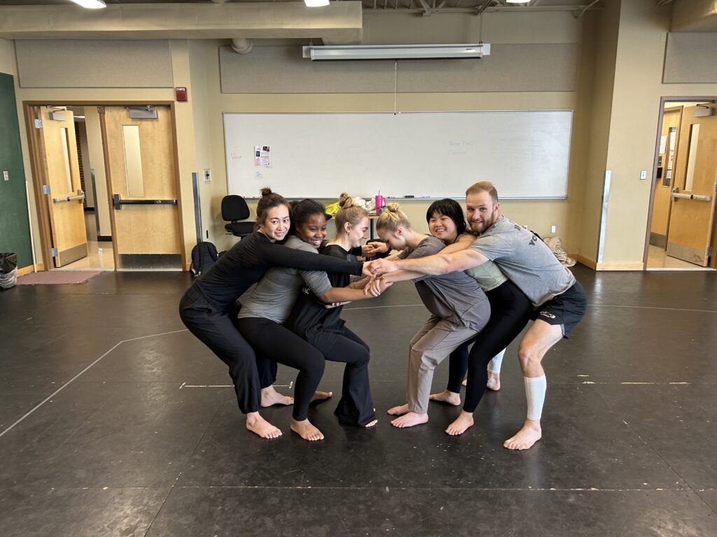 Image of Chinese Dance teacher Rose Xinran Qi with her students in a partnering class taught by Executive Director Peter Pucci