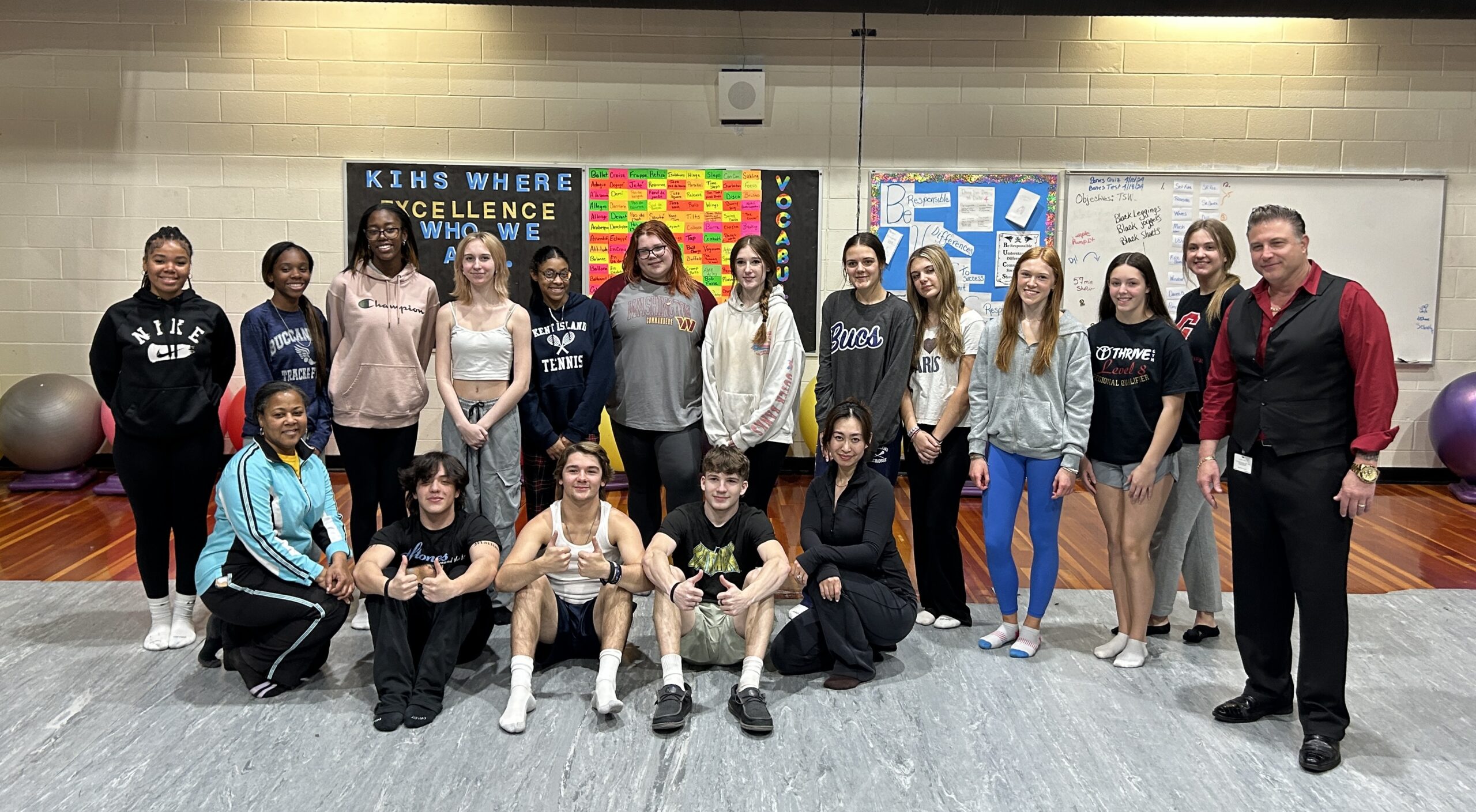 CCF Executive Peter Pucci with Kent Island High School Dance Teacher Amber Wright and her dance students with QACPS Supervisor for Instruction Michael Bell on the right. Rose Xinran Qi on knee in front row in black.