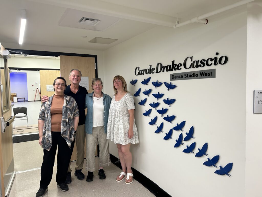 Anne Lefter, Director of the Performing Arts at CCBC, Peter Pucci, Ann Goodman, and Adrienne Kraus Latanishen at the entrance to the Carole Drake Cascio Dance Studio West where the Bird Donation Sculpture is located.