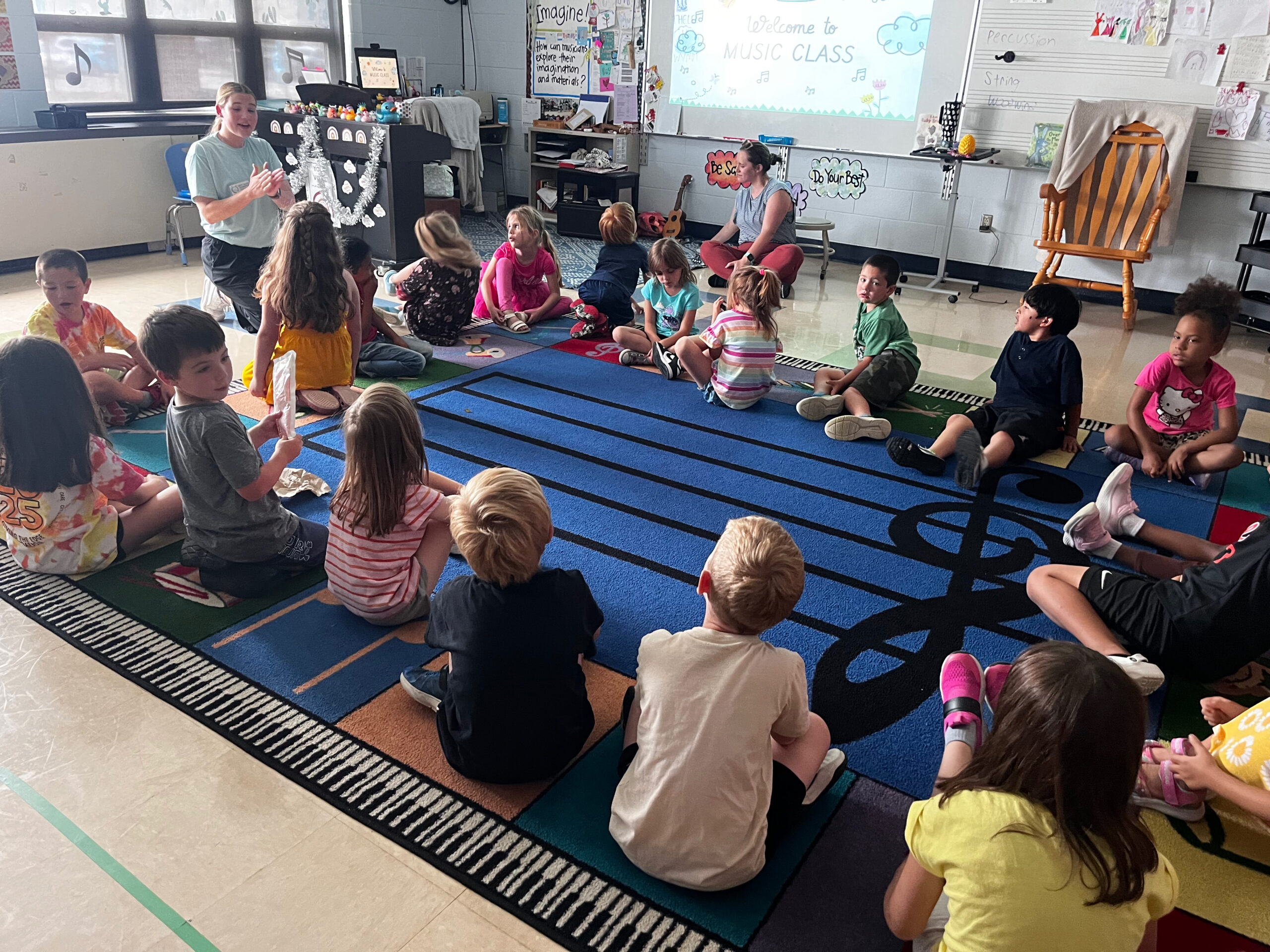 Gabby and Mrs. Erica Beyer working on movement ideas with students at Kennard Elementary School.