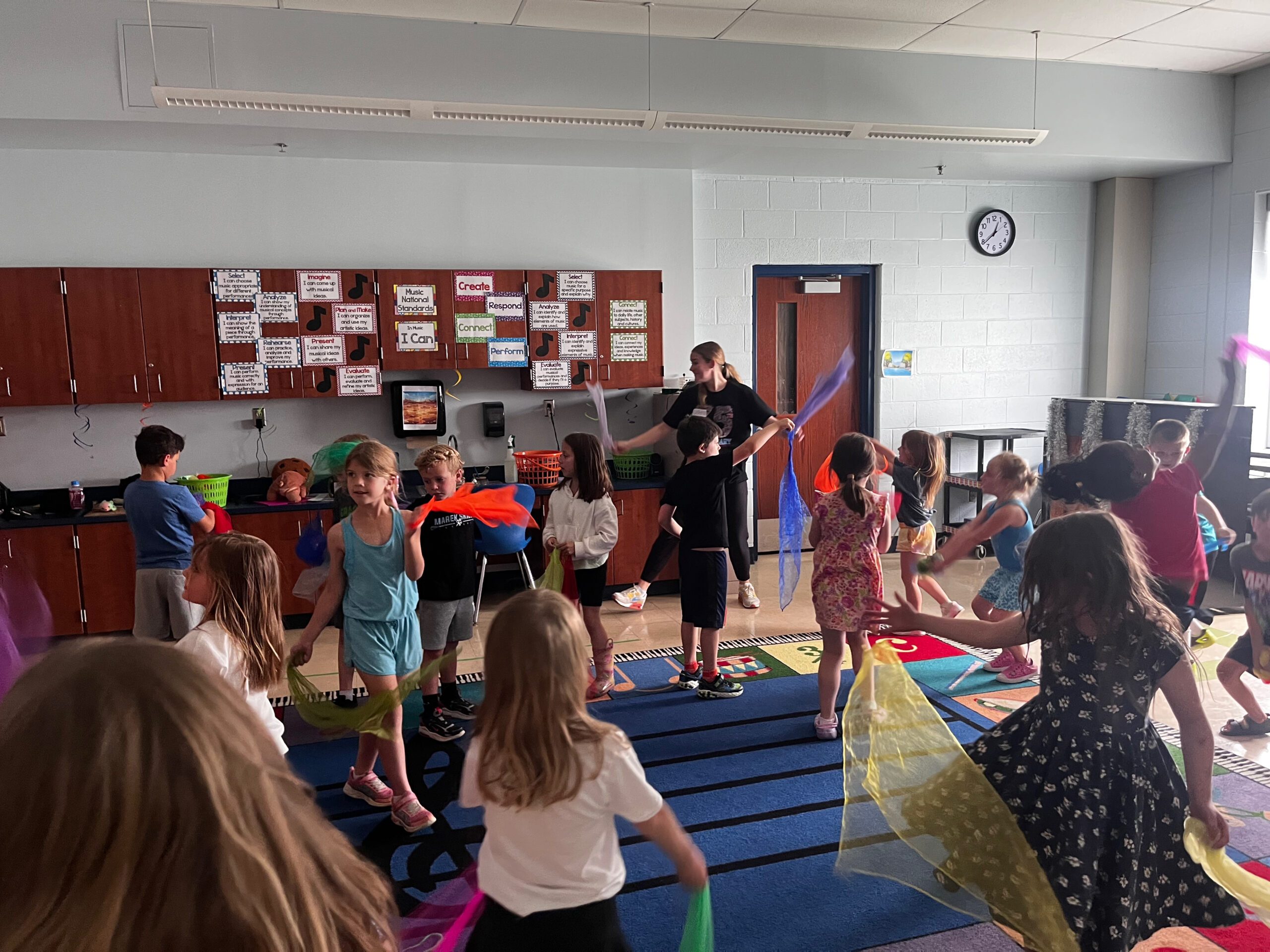 Kent Island Elementary School students dancing with scarves in Gabby’s Move & Groove class.