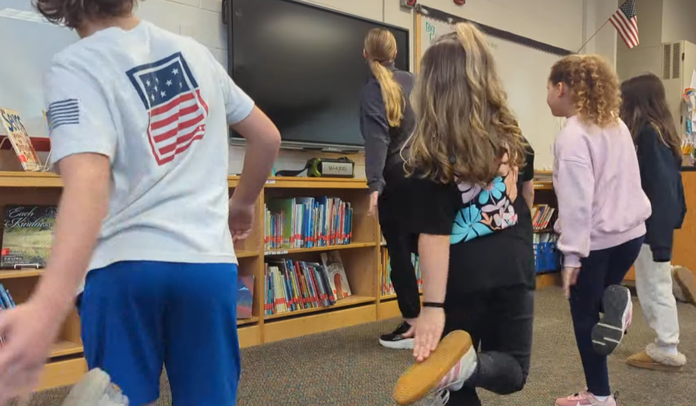 CCF Teaching Artist teaching her Move & Groove class to Kennard Elementary School students.