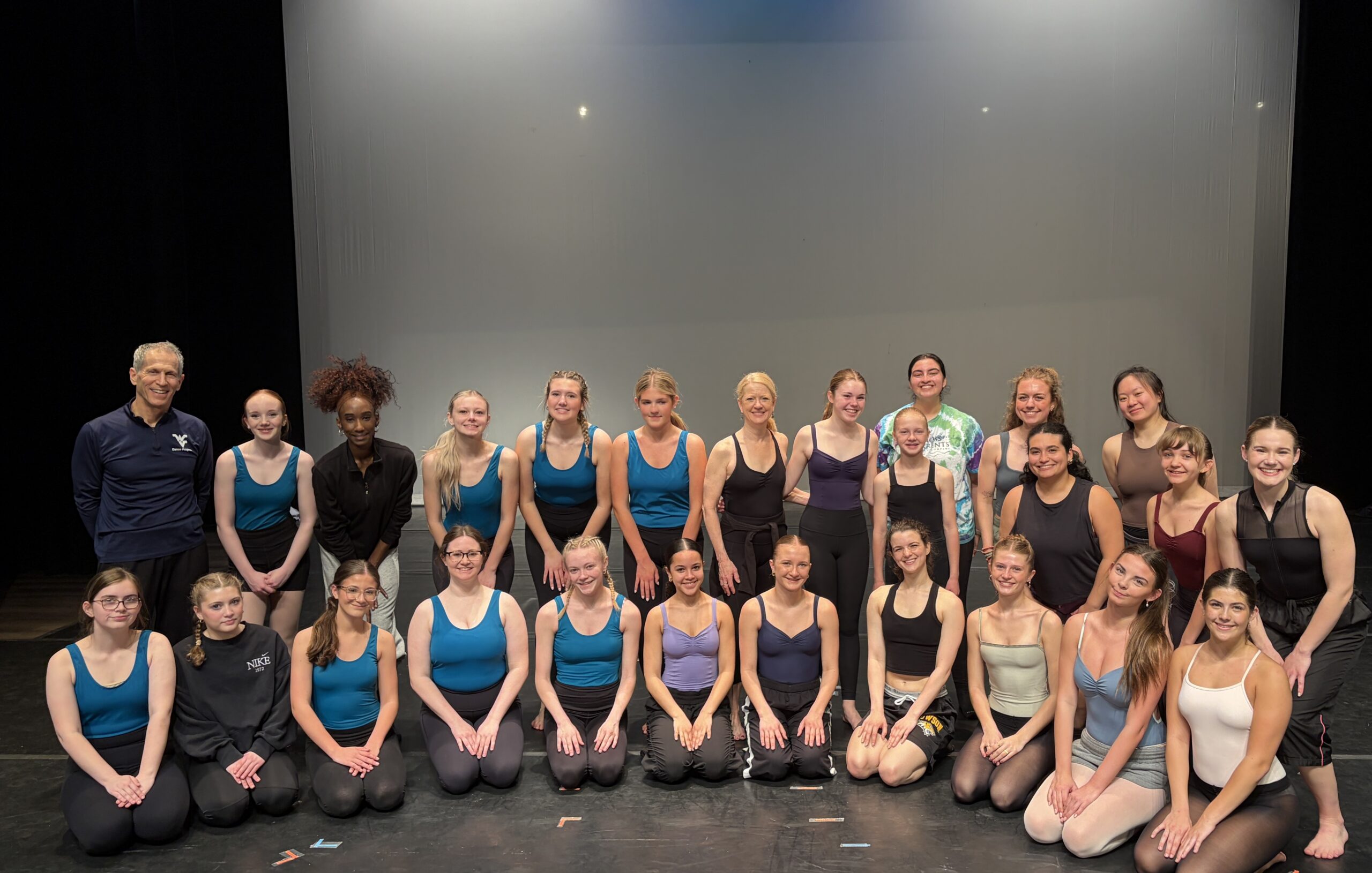 Yoav Kaddar (L), Guest Artist with dancers from the local community.
